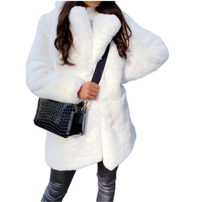 Person wearing a white fur coat with a black handbag on a light background
