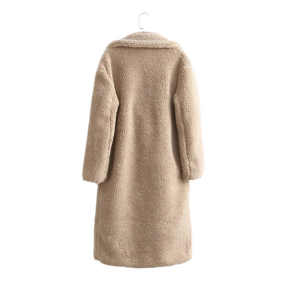 Beige coat on a hanger against a white background