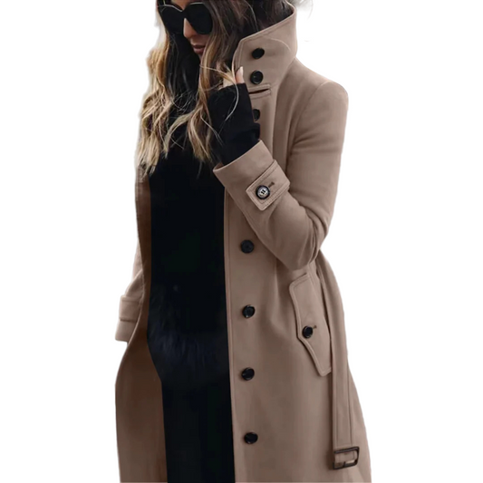 Woman wearing a beige trench coat on a city street.