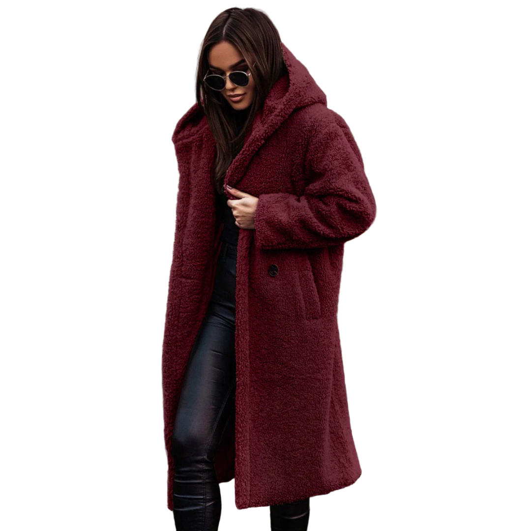 Person wearing a long burgundy coat on a white background