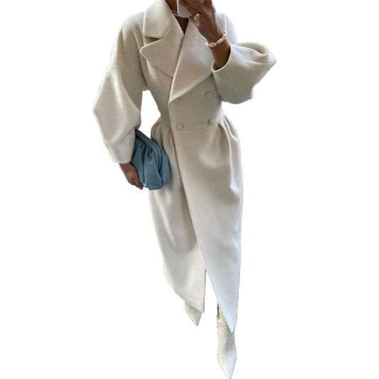 Person wearing a white coat on a tiled pavement.