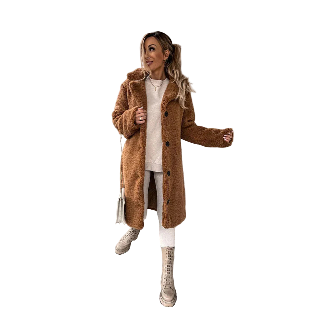 Woman in a brown coat standing on concrete stairs