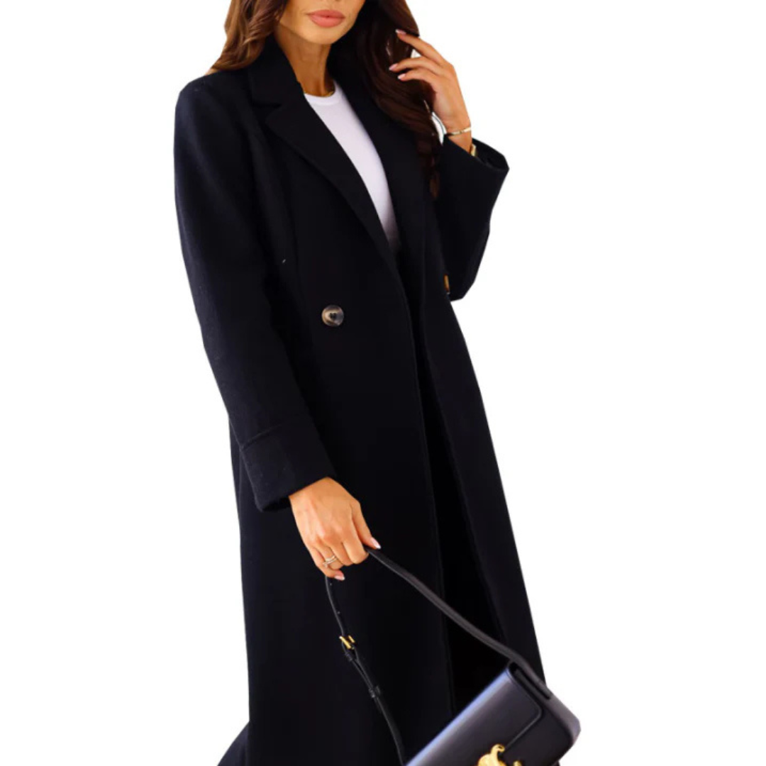 Woman wearing a black coat holding a matching handbag on a white background