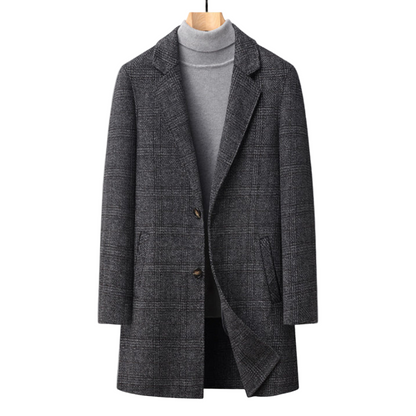 Gray checkered coat on a mannequin against a gray background