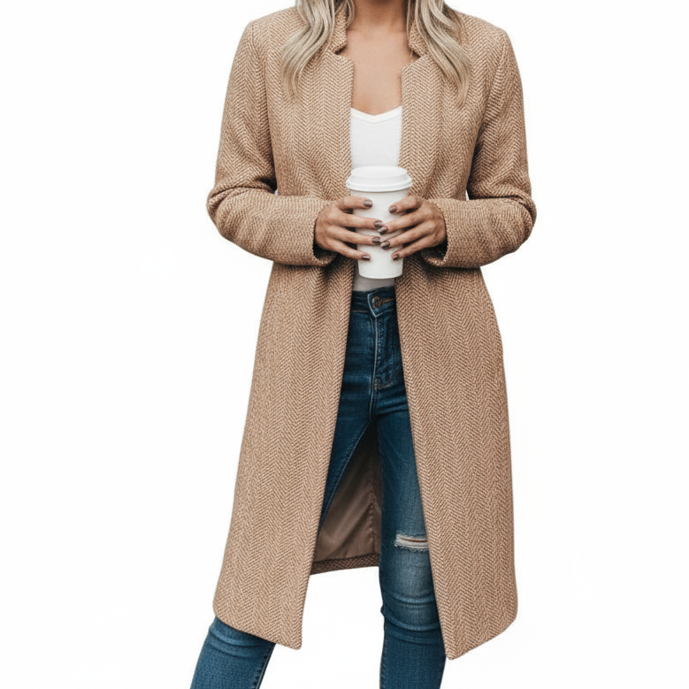 Woman wearing a beige cardigan holding a coffee cup against a neutral background